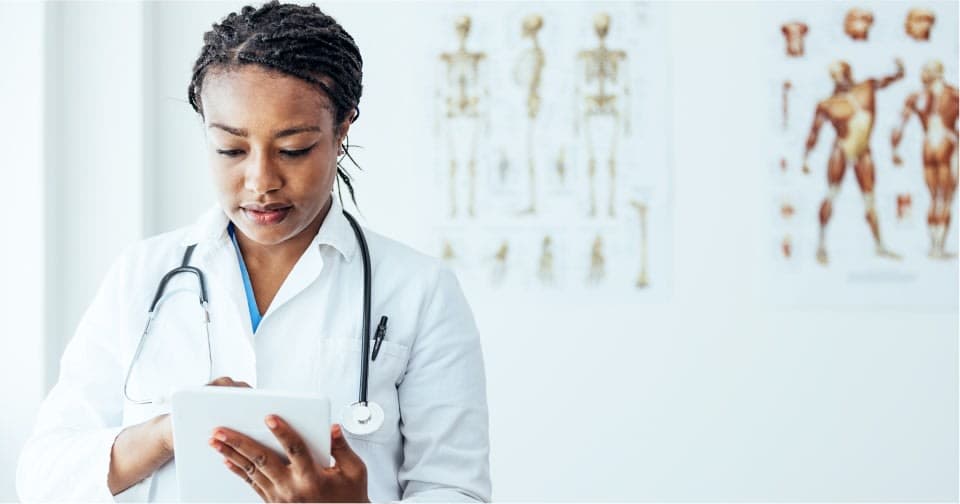 Healthcare and technology specialists reviewing clinical data together
